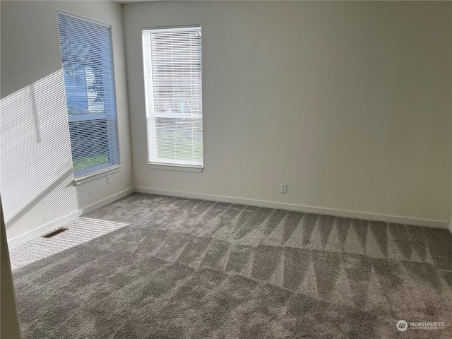 empty room featuring carpet flooring