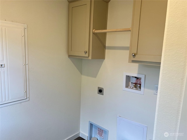 laundry area featuring washer hookup, electric dryer hookup, electric panel, and cabinets