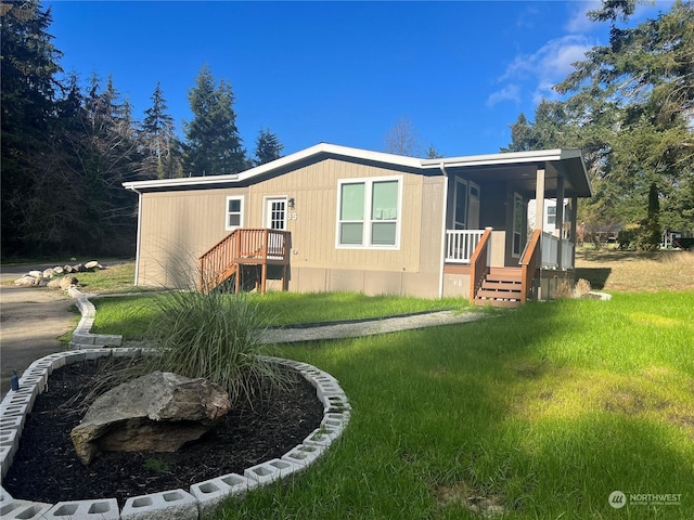 exterior space with a porch and a yard