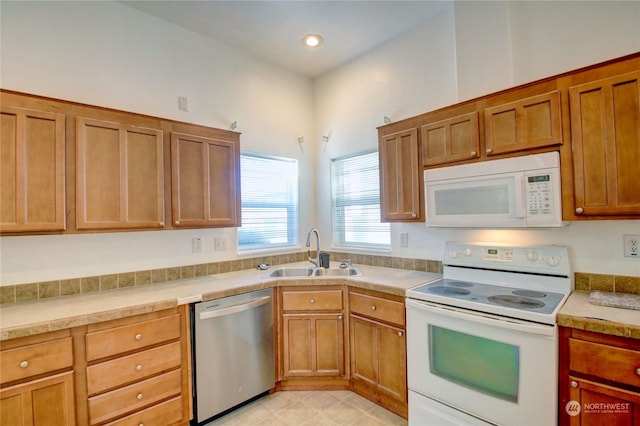 kitchen featuring sink and white appliances