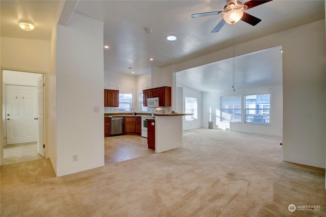 kitchen with light colored carpet, light countertops, open floor plan, and white appliances