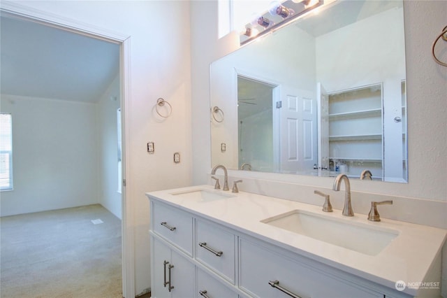 bathroom with double vanity and a sink