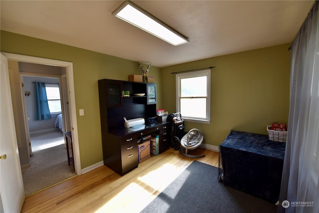 office with light hardwood / wood-style floors