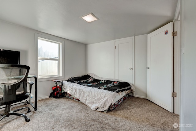 bedroom featuring light colored carpet