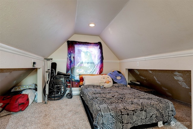 carpeted bedroom with vaulted ceiling and a textured ceiling