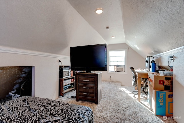 carpeted bedroom with cooling unit, vaulted ceiling, and a textured ceiling