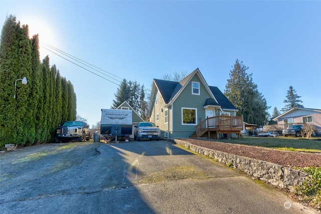 view of front of property featuring a wooden deck