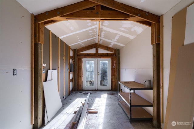 interior space featuring lofted ceiling and french doors