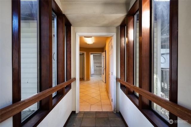 corridor with dark tile patterned floors