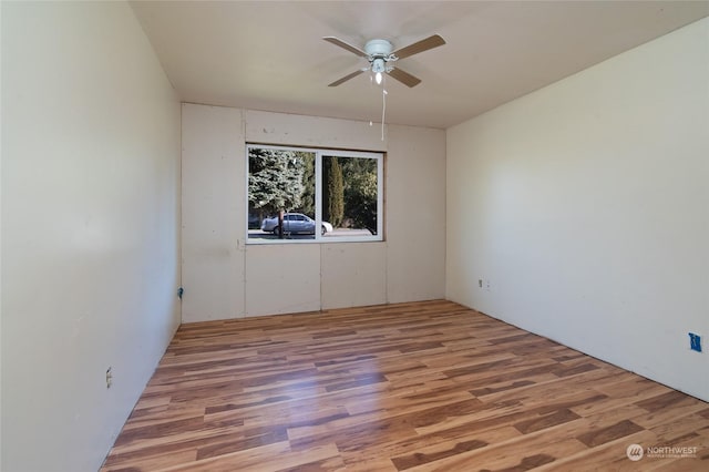 spare room featuring hardwood / wood-style flooring and ceiling fan