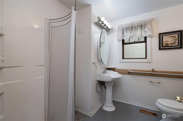 bathroom featuring toilet