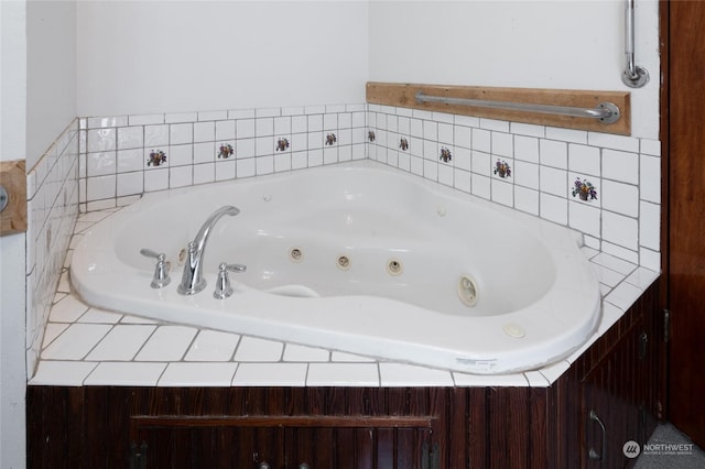 bathroom with a relaxing tiled tub