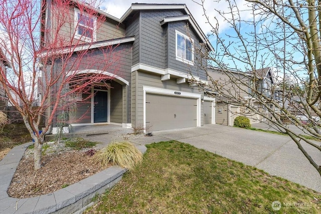 view of front of property featuring a garage and driveway