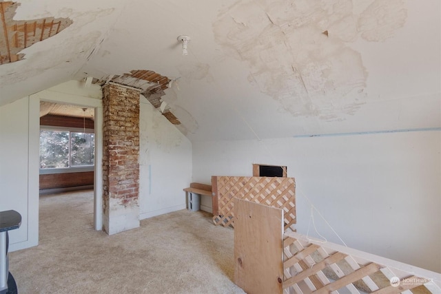 bonus room featuring lofted ceiling and light carpet