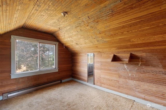 additional living space featuring lofted ceiling, a baseboard heating unit, wooden ceiling, and wood walls