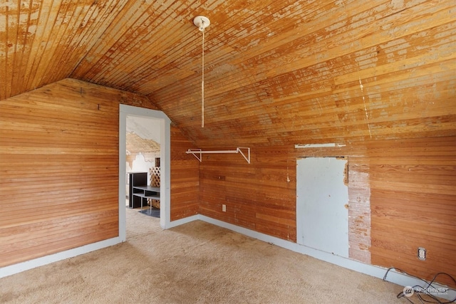 bonus room featuring lofted ceiling, wooden ceiling, carpet, and wooden walls