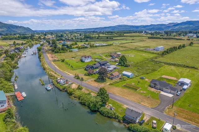 bird's eye view featuring a rural view and a water and mountain view