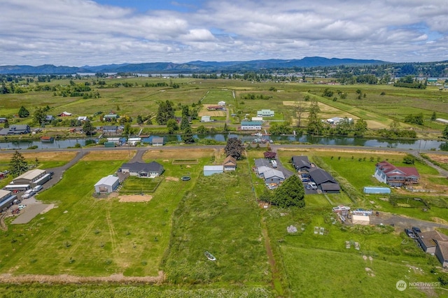 bird's eye view featuring a rural view and a water and mountain view