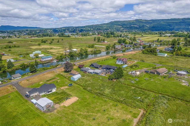 birds eye view of property featuring a rural view and a water and mountain view