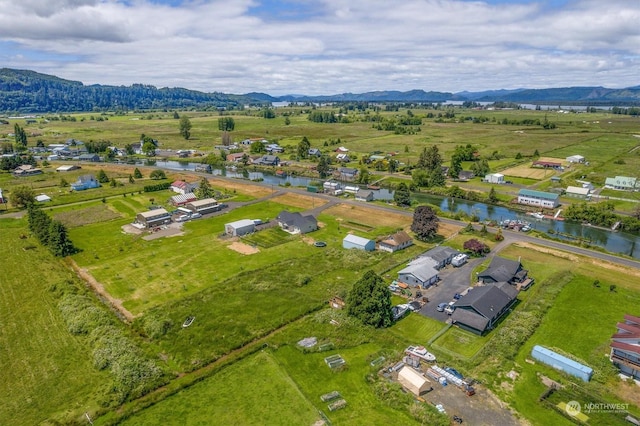 aerial view featuring a rural view and a water and mountain view