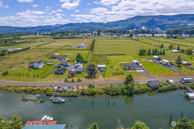 bird's eye view featuring a rural view and a water and mountain view