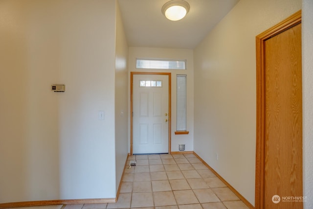 foyer featuring light tile patterned floors