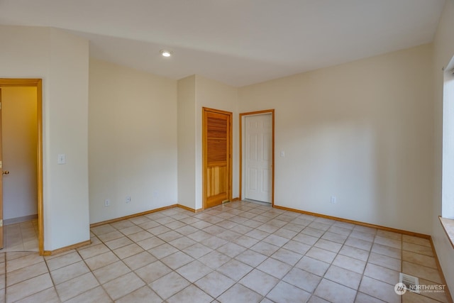 spare room with light tile patterned flooring