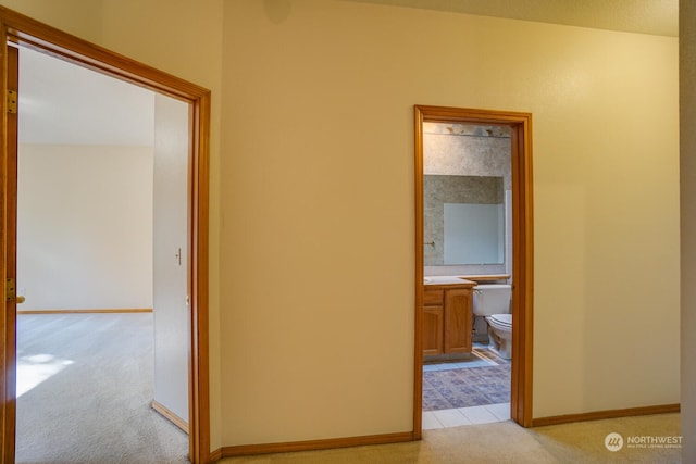 corridor with light colored carpet