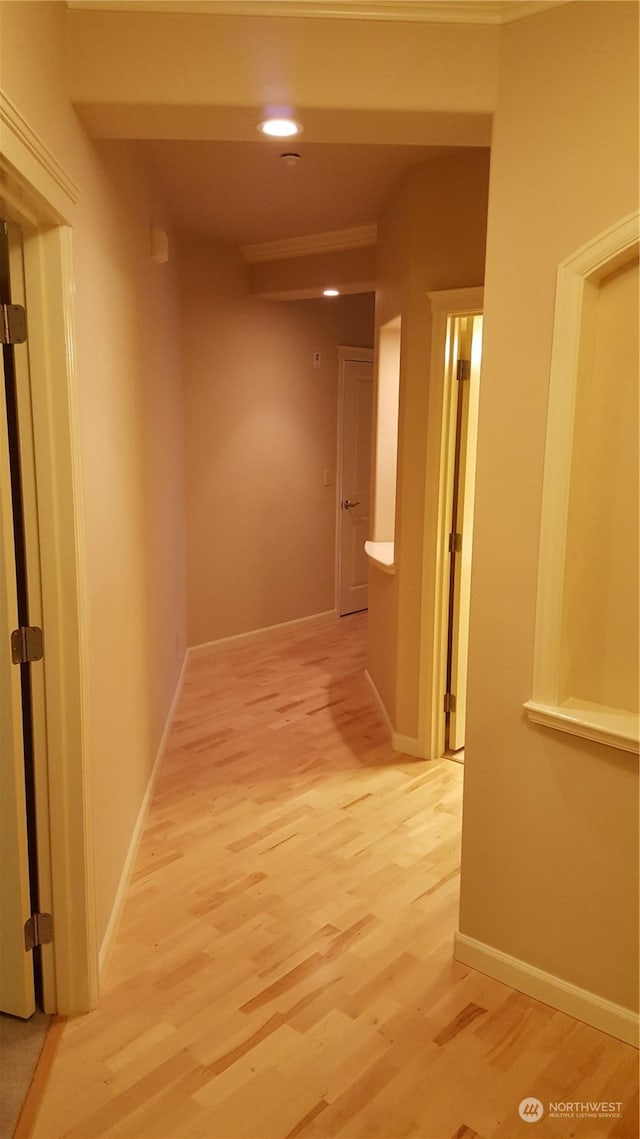 hall with light hardwood / wood-style floors