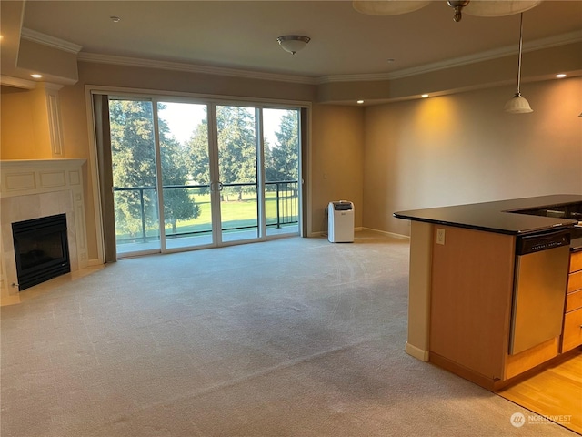 unfurnished living room with crown molding, light colored carpet, and a fireplace