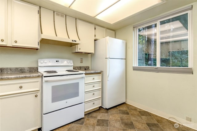 kitchen featuring white appliances, exhaust hood, and white cabinets