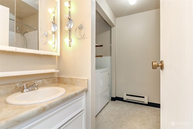 bathroom featuring vanity, a baseboard radiator, and independent washer and dryer