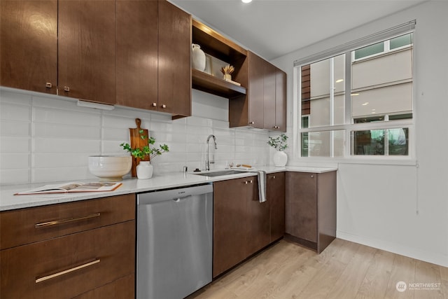 kitchen featuring sink, dark brown cabinets, light hardwood / wood-style floors, and dishwasher