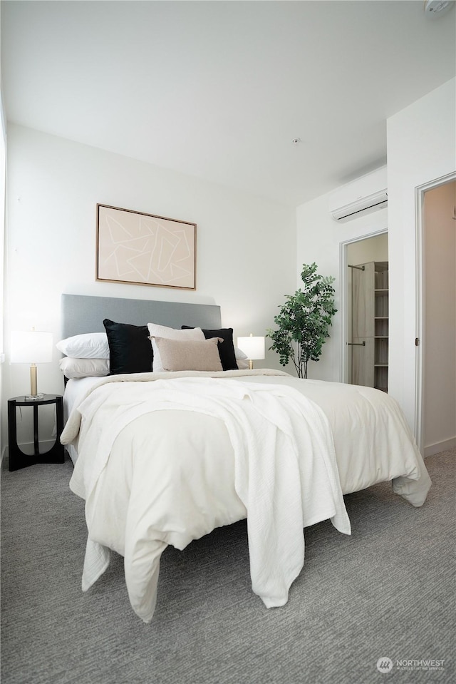 carpeted bedroom featuring a wall unit AC