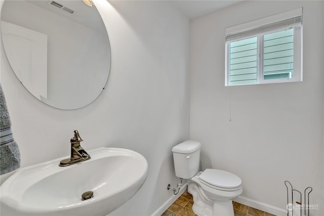 bathroom with sink and toilet