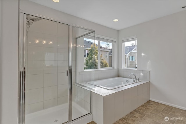 bathroom with independent shower and bath