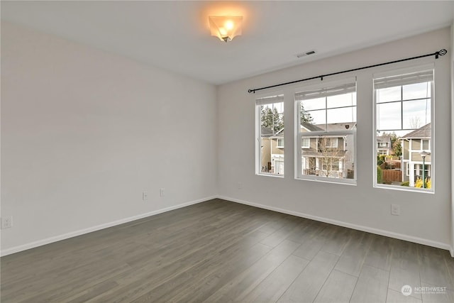 empty room featuring dark hardwood / wood-style floors