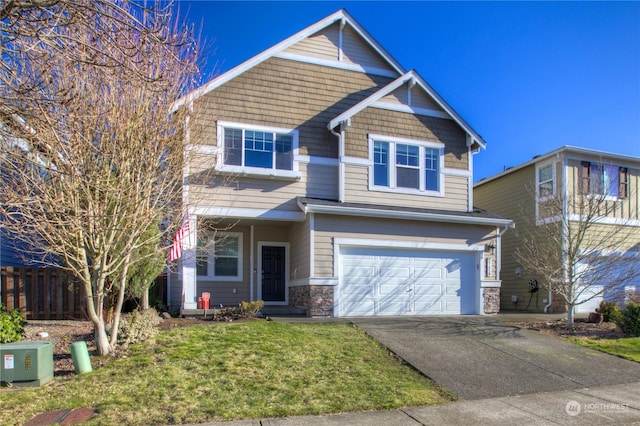 view of front facade featuring a garage and a front yard