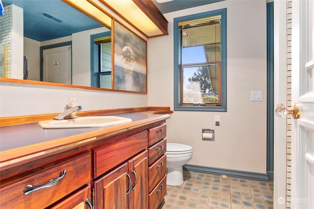 bathroom with vanity and toilet