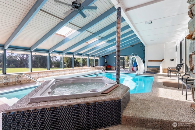 view of pool with an in ground hot tub, ceiling fan, a water slide, and a patio