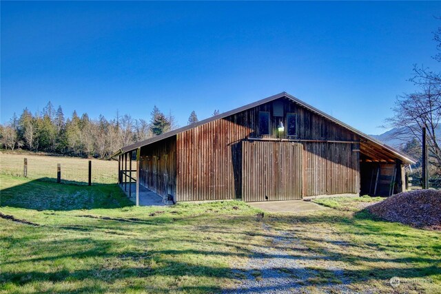 view of outdoor structure featuring a yard