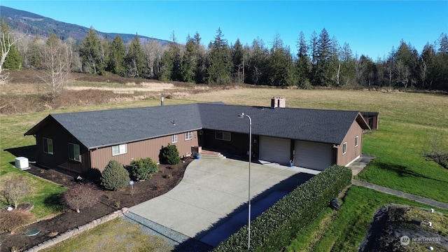 birds eye view of property with a mountain view