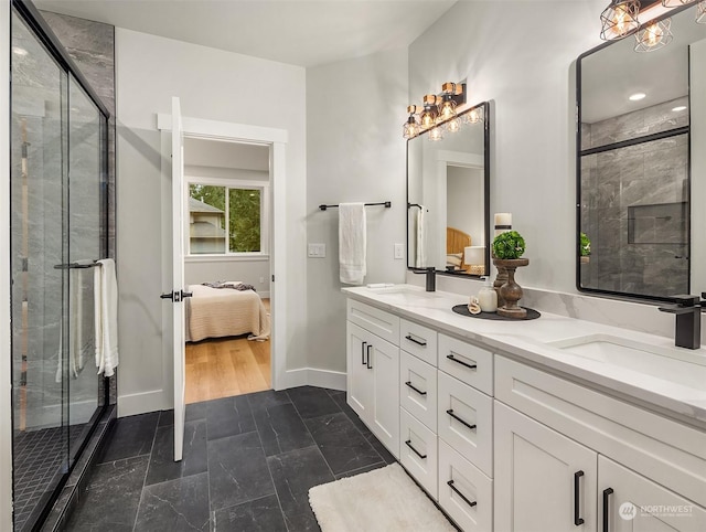 bathroom featuring vanity and a shower with shower door