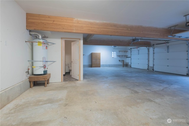 garage with a garage door opener and secured water heater