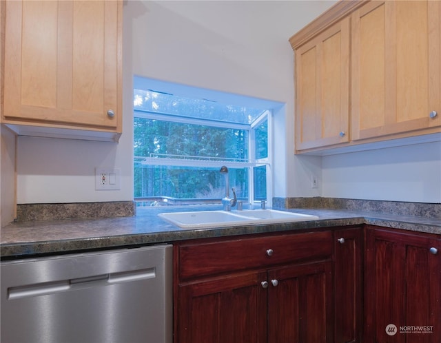 kitchen featuring light brown cabinetry, sink, and stainless steel dishwasher