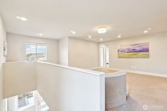 hall with carpet floors, recessed lighting, an upstairs landing, and baseboards