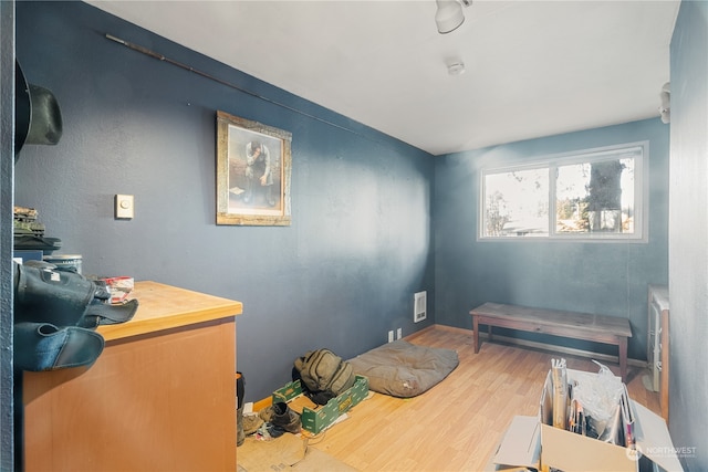 miscellaneous room featuring wood-type flooring