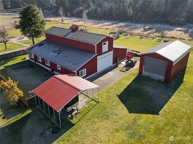 birds eye view of property with a rural view