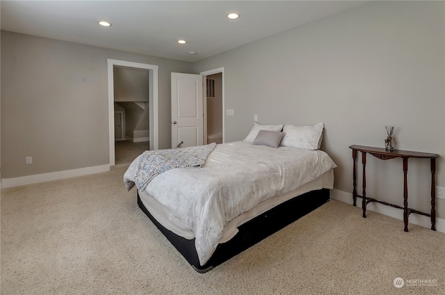 bedroom featuring light carpet