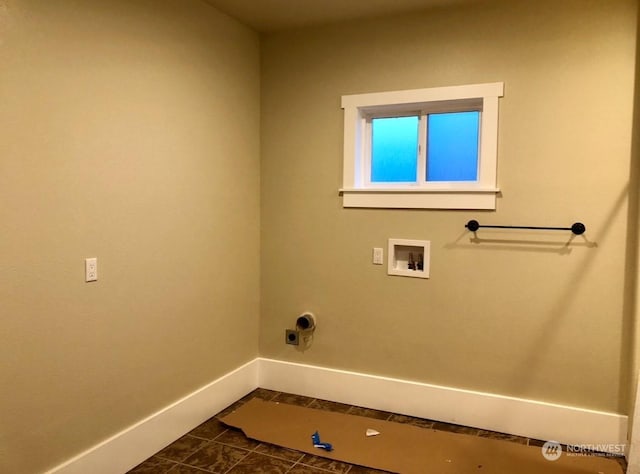 clothes washing area featuring electric dryer hookup, hookup for a washing machine, and dark tile patterned floors